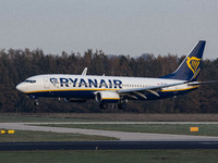 A Ryanair Boeing 737-800 aircraft as seen on final approach flying, touching down and taxiing in Eindhoven EIN EHEH Airport in the Netherlan...