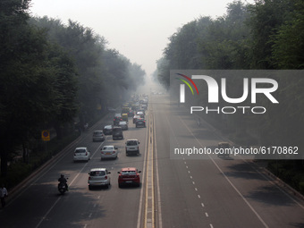 Vehicular traffic at Tilak Marg on a hazy day amid deteriorating air quality across the national capital region (NCR), on November 8, 2020 i...