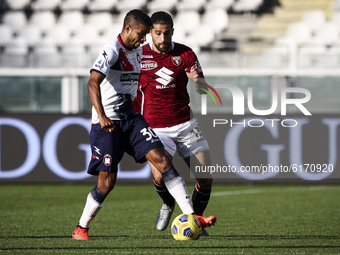 Crotone midfielder Junior Messias (30) fights for the ball against Torino defender Ricardo Rodriguez (13) during the Serie A football match...