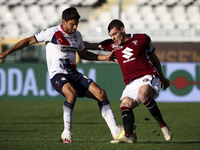 Torino forward Andrea Belotti (9) fights for the ball against Crotone defender Lisandro Magallan (6) during the Serie A football match n.7 T...