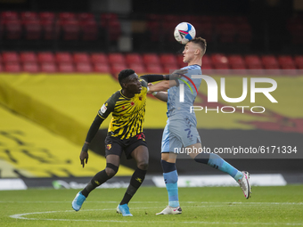   Ismaila Sarr of Watford and Leo Ostigard of Coventry City during the Sky Bet Championship match between Watford and Coventry City at Vicar...