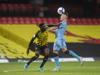   Ismaila Sarr of Watford and Leo Ostigard of Coventry City during the Sky Bet Championship match between Watford and Coventry City at Vicar...