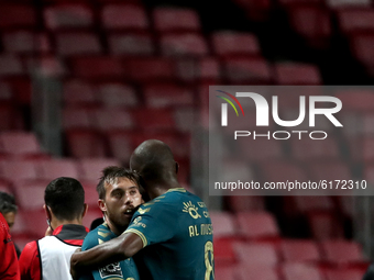 Iuri Medeiros of SC Braga (L ) celebrates with teammates after scoring during the Portuguese League football match between SL Benfica and SC...