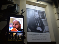 A portrait of Cardinal Dziwisz seen on a mobile phone in Krakow's Kanoniczna Street, right after the TVN 24 program 'Don Stanislao. The seco...