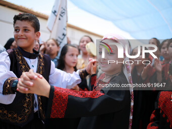 Within psychological support programs for children and entertaining celebration of dance and popular Dabke in Gaza(