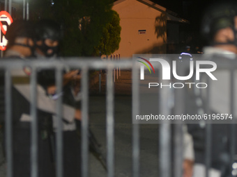 Police are on guard around the Bhayangkara Hospital where the bodies of the two Poso Mujahidin Indonesia (MIT) terrorists underwent an ident...