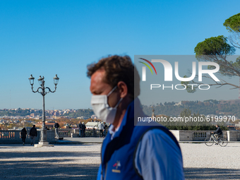 People walks in Rome, Italy, on November 20, 2020 amid the Covid-19 pandemic. (