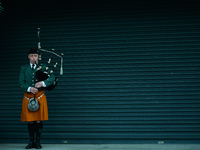 A lone piper seen outside Croke Park in Dublin, during a commemoration event to mark the centenary of Bloody Sunday, organised by 'The 1916...