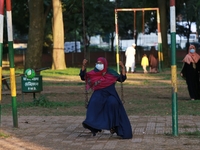 A woman play on swing at a park amid the COVID-19 coronavirus pandemic in Dhaka, Bangladeah on November 23, 2020. (