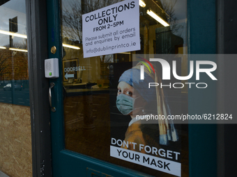 Signs 'Don't Forget You Mask' and 'Collections Only' seen on an entrance door in Dublin's city centre.
On Monday, November 23, 2020, in Dubl...