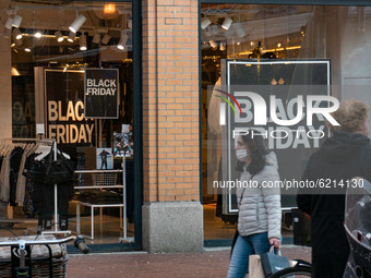 Black Friday signs with sale as seen in the front display window of a shop in Eindhoven city center.  Daily life in Eindhoven the Netherland...