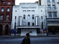 A man walks past the temporarily closed Trafalgar Theatre on a quiet Whitehall in London, England, on November 23, 2020. Across England non-...