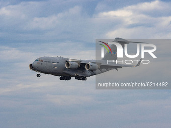 A SAC Strategic Airlift Capability Boeing C17 Globemaster III as seen on final approach flying, touching down and taxiing while arriving in...