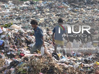  Indian rag-picker looks for recyclable material at a municipal waste dumping site on World Environment Day in Dimapur, India north eastern...