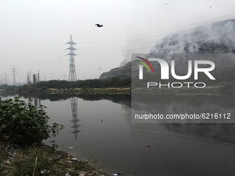 A view of smoke billowing after a fire broke out at east Delhi's Ghazipur landfill in New Delhi on November 25, 2020. Air quality monitoring...