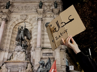 Women gathered at the place du Saint Michel for a rally marking the International Day for the Elimination of Violence against Women in Paris...