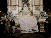 Women gathered at the place du Saint Michel for a rally marking the International Day for the Elimination of Violence against Women in Paris...
