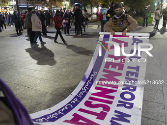 A woman prepares one of the banners that will be displayed at the rally in the city of Santander (Spain), on November 25, 2020  for the inte...