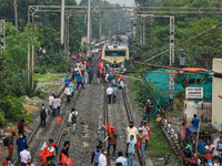 Protestors blocked off railway tracks and disrupted local railway services in support of the All India strike, in Kolkata, India, on Novembe...