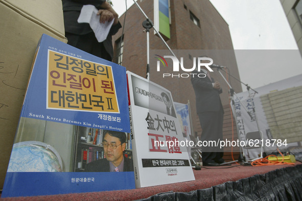 A Conservative group members rally during an Opposition of Ex-President Kim Dae Jung visit North Korea at near Kim's house in Seoul, South K...