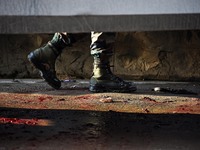  An Indian army soldier walks near the blood stains of his fallen comrades at HMT area of Srinagar,Kashmir on November 26,2020.Inspector Gen...