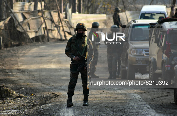  An Indian army soldier guards the main road near the site of attack at HMT area of Srinagar,Kashmir on November 26,2020.Inspector General o...