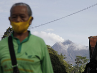 The morning activities of local residents at Butuh traditional market, about 14 kilometers from the summit of mount Merapi, as the solfatara...