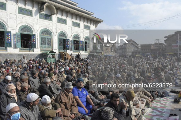 People pray outside Khanyar shirine on the eve of urs of Sheikh Abdul Qadir Jeelani in Srinagar, Indian Administered Kashmir on 27 November...