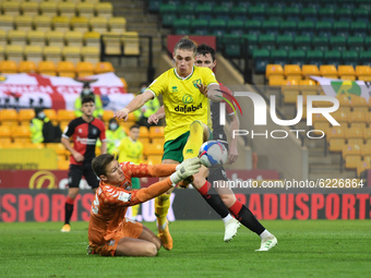 Coventry's Ben Wilson fouls Norwichs Przemyslaw Placheta for a penalty during the Sky Bet Championship match between Norwich City and Covent...