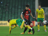Coventrys Ryan Giles stops Norwichs Max Aarons path during the Sky Bet Championship match between Norwich City and Coventry City at Carrow R...