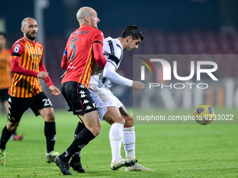 Alvaro Morata of Juventus FC and Luca Caldirola of Benevento Calcio compete for the ball during the Serie A match between Benevento Calcio a...