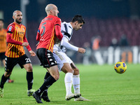 Alvaro Morata of Juventus FC and Luca Caldirola of Benevento Calcio compete for the ball during the Serie A match between Benevento Calcio a...