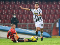 Kamil Glik of Benevento Calcio and Paulo Dybala of Juventus FC compete for the ball during the Serie A match between Benevento Calcio and Ju...