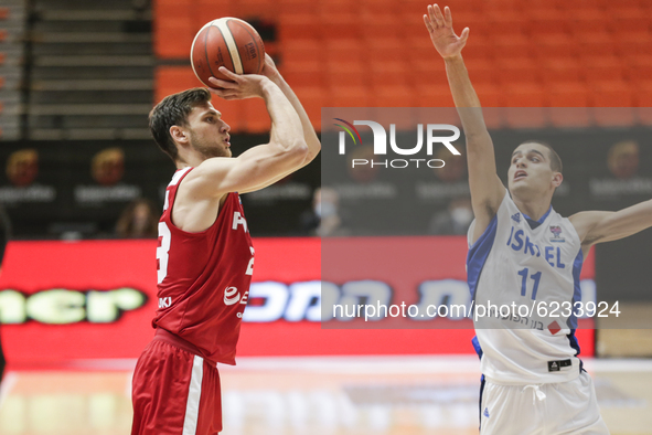 23 Michal Michalak of Poland defended by 11 Yam Madar of Israel during the FIBA EuroBasket 2022 Qualifiers match of group A between Israel a...