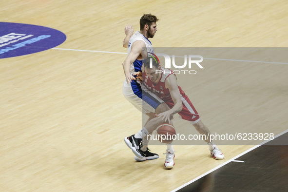 15 Kamil Laczynski of Poland defended by 09 Golan Gutt of Israel during the FIBA EuroBasket 2022 Qualifiers match of group A between Israel...