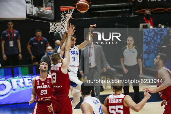 11 Yam Madar of Israel defended by 03 Michal Sokolowski of Poland during the FIBA EuroBasket 2022 Qualifiers match of group A between Israel...
