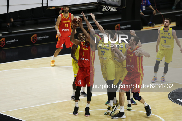 01 Jose Miguel Perez Balbuena of Spain defended by 77 Mihai Marius Maciuca of Romania during the FIBA EuroBasket 2022 Qualifiers match of gr...