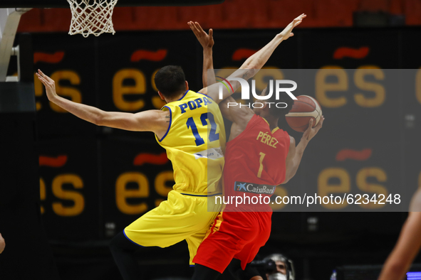 12 Bogdan Popa of Romania and 01 Jose Miguel Perez Balbuena of Spain during the FIBA EuroBasket 2022 Qualifiers match of group A between Spa...
