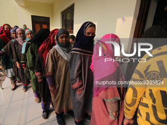 Women voters in queue to cast their votes during the second phase of District Development Council (DDC) election in Lalpora area of north Ka...