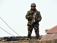 A paramilitary soldier keeping vigil outside the polling station during the second phase of District Development Council (DDC) election in n...