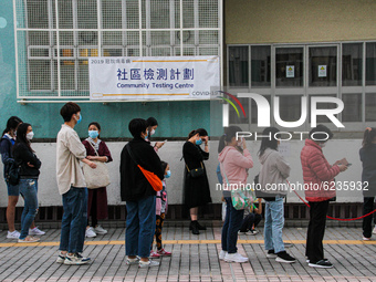 Hong Kong residents line up to take a Covid-19 test amid a surge in cases within the city, Lek Yuen Community Hall, Shatin, Hong Kong, 1st D...