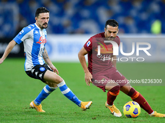 Pedro of AS Roma and Mario Rui of SSC Napoli compete for the ball during the Serie A match between SSC Napoli and AS Roma at Stadio San Paol...