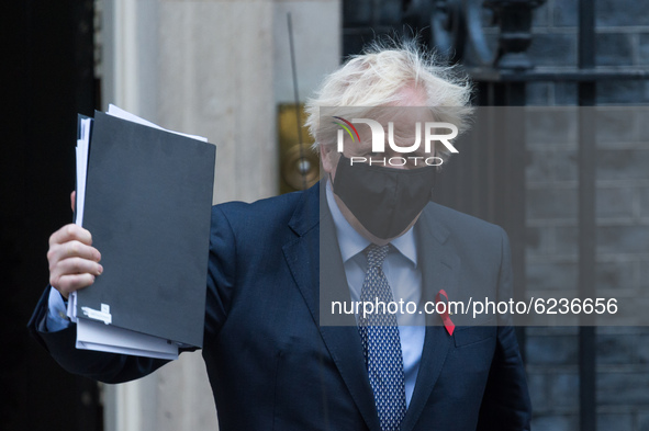 British Prime Minister Boris Johnson leaves 10 Downing Street for the House of Commons to open a debate on the new tiered Coronavirus restri...
