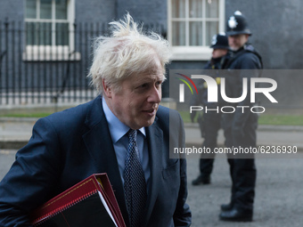 British Prime Minister Boris Johnson leaves 10 Downing Street in central London to attend Cabinet meeting held at the Foreign Office on 01 D...