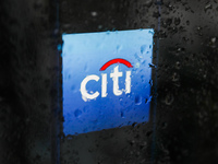 Citi logo displayed on a phone screen is seen through raindrops on the window in this illustration photo taken in Poland on November 30, 202...