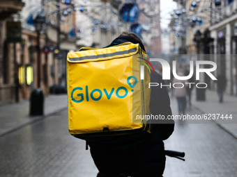 Glovo food delivery courier is seen in Krakow, Poland on Novemver 30, 2020. (