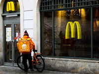 Food delivery courier near the McDonald's restaurant in Krakow, Poland on November 30, 2020. (