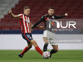Marcos Llorente of Atletico Madrid  and Lucas Hernandez of Bayern compete for the ball during the UEFA Champions League Group A stage match...