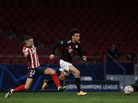 Leroy Sane of Bayern and Mario Hermoso of Atletico Madrid compete for the ball during the UEFA Champions League Group A stage match between...