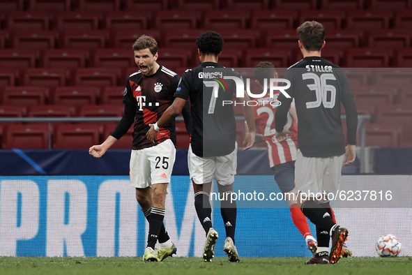 Thomas Muller of Bayern celebrates after scoring his sides first goal during the UEFA Champions League Group A stage match between Atletico...